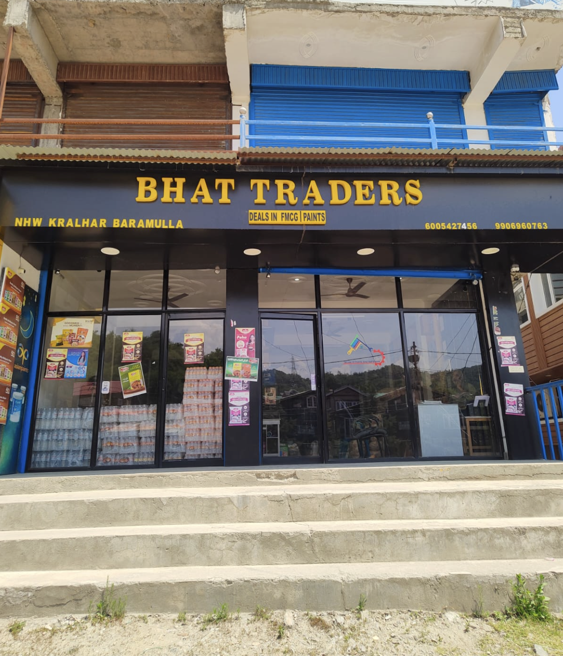 Bhat Traders building exterior with steps